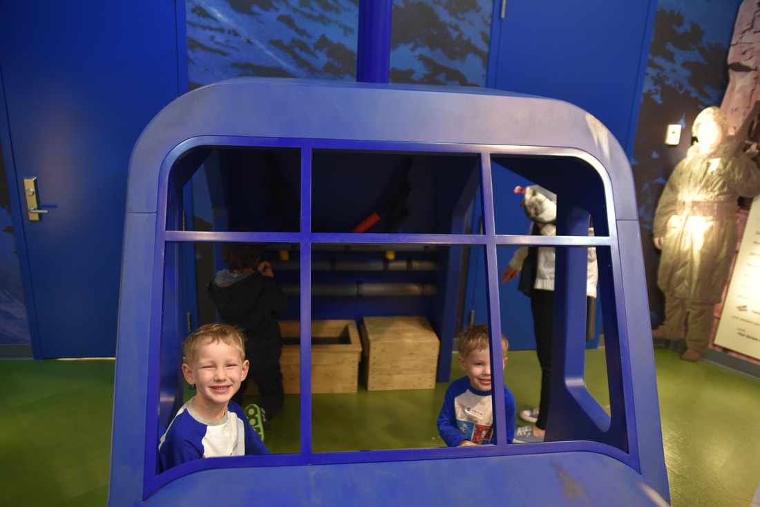 Two boys playing in Children's Gallery  helicopter