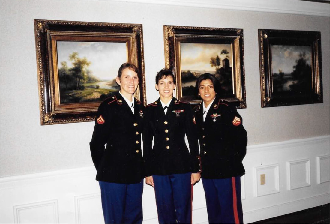 Christina Johnson in Marine uniform standing with two female Marines