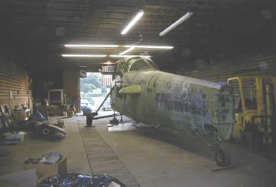 The UH-34D being restored in a barn.