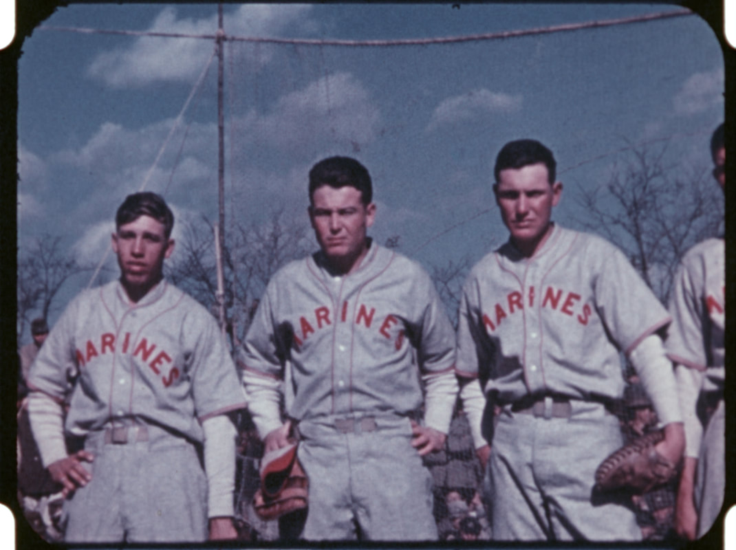 Three Marines in baseball uniforms post WWII in Japan