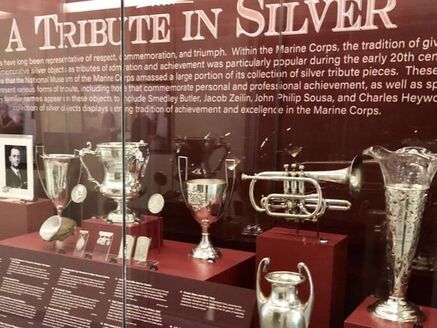 A Tribute in Silver exhibition case featuring silver artifacts